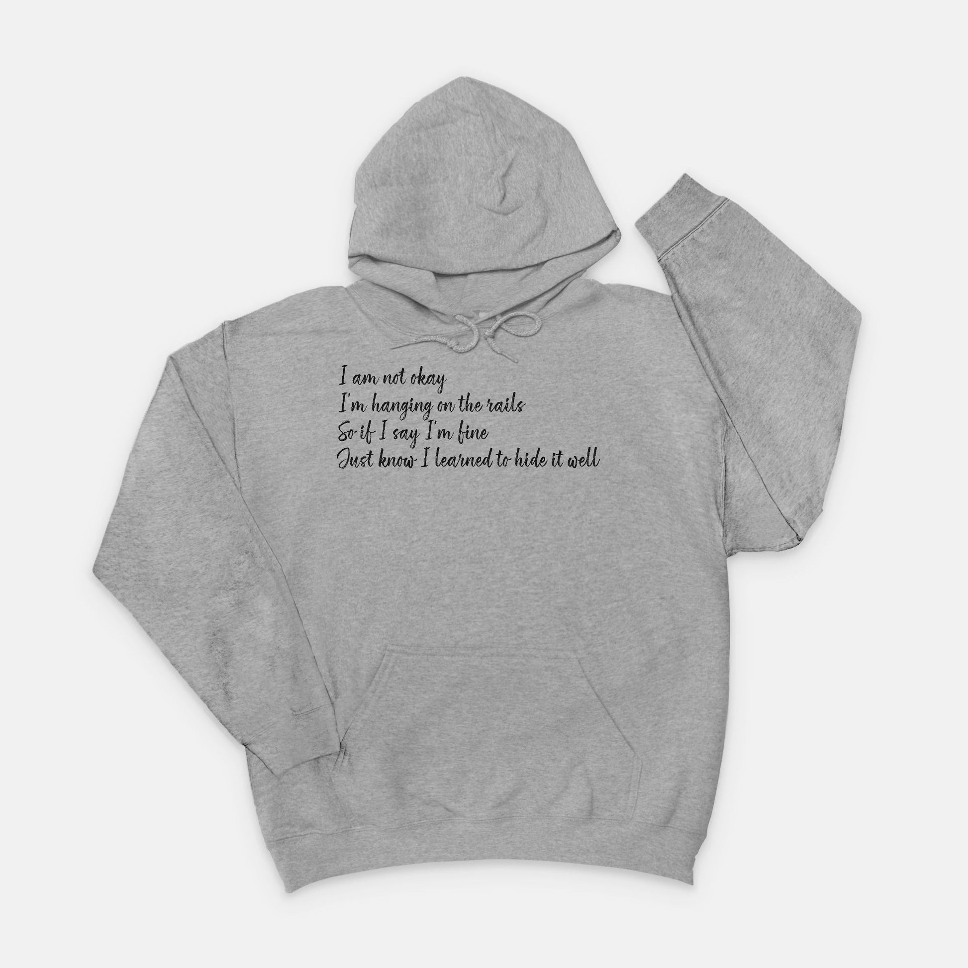 Gray hoodie with text im not okay hanging on the rails hoodie on a white background