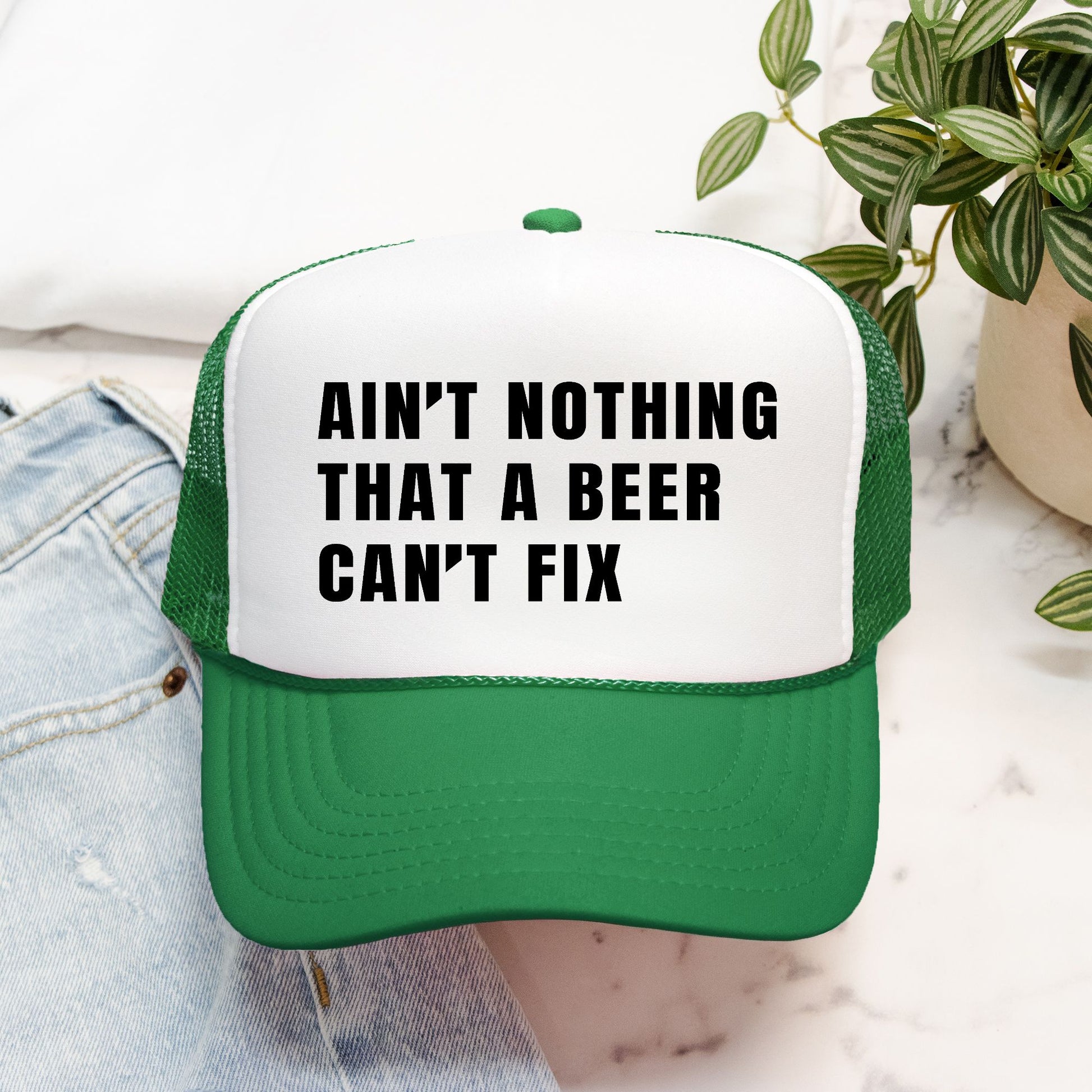 Ain’t Nothing That a Beer Can’t Fix Foam Embroidered Trucker Hat in Black Text