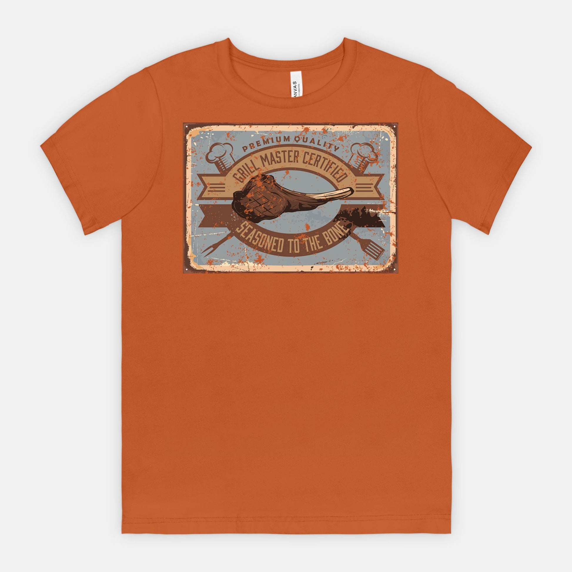 Auburn t-shirt with a graphic Grill Master Certified - Seasoned to the Bone on a white background