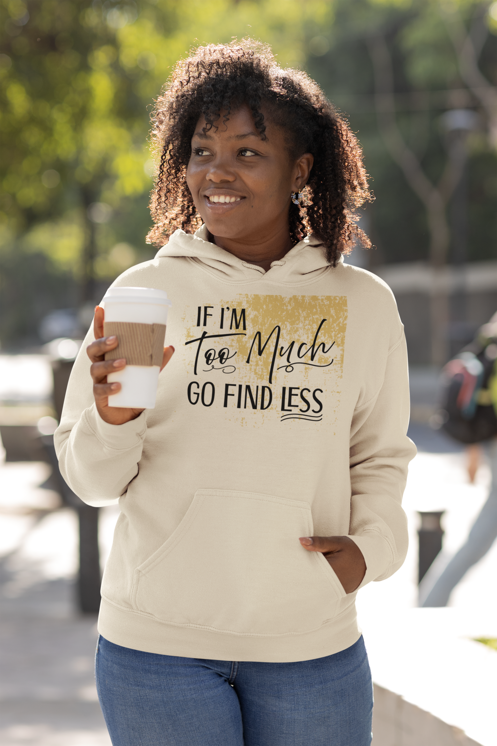 Army green hoodie with gold splatter design and black text reading “If I’m Too Much Go Find Less” by Red Rock Chaos.