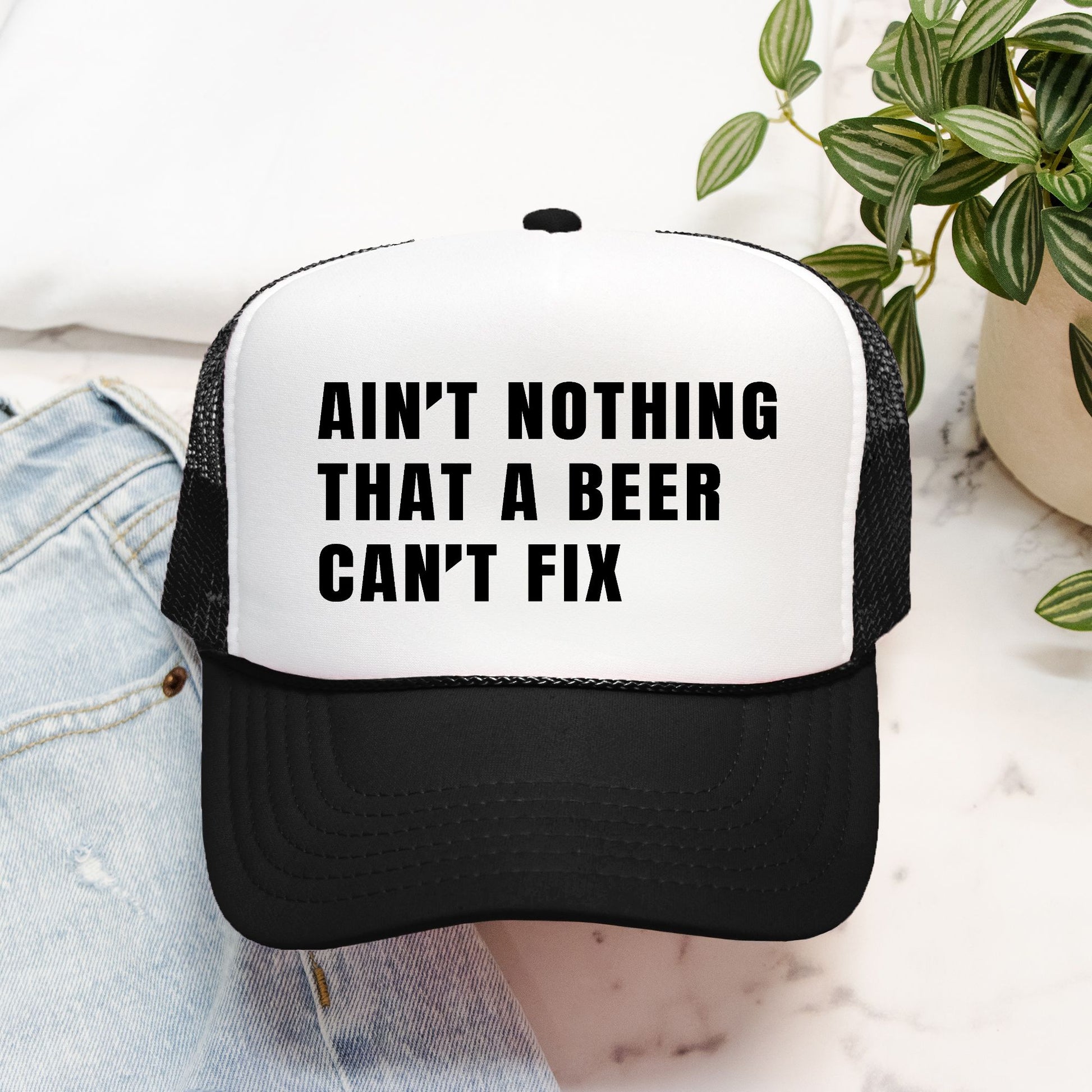 Ain’t Nothing That a Beer Can’t Fix Foam Embroidered Trucker Hat in Black Text