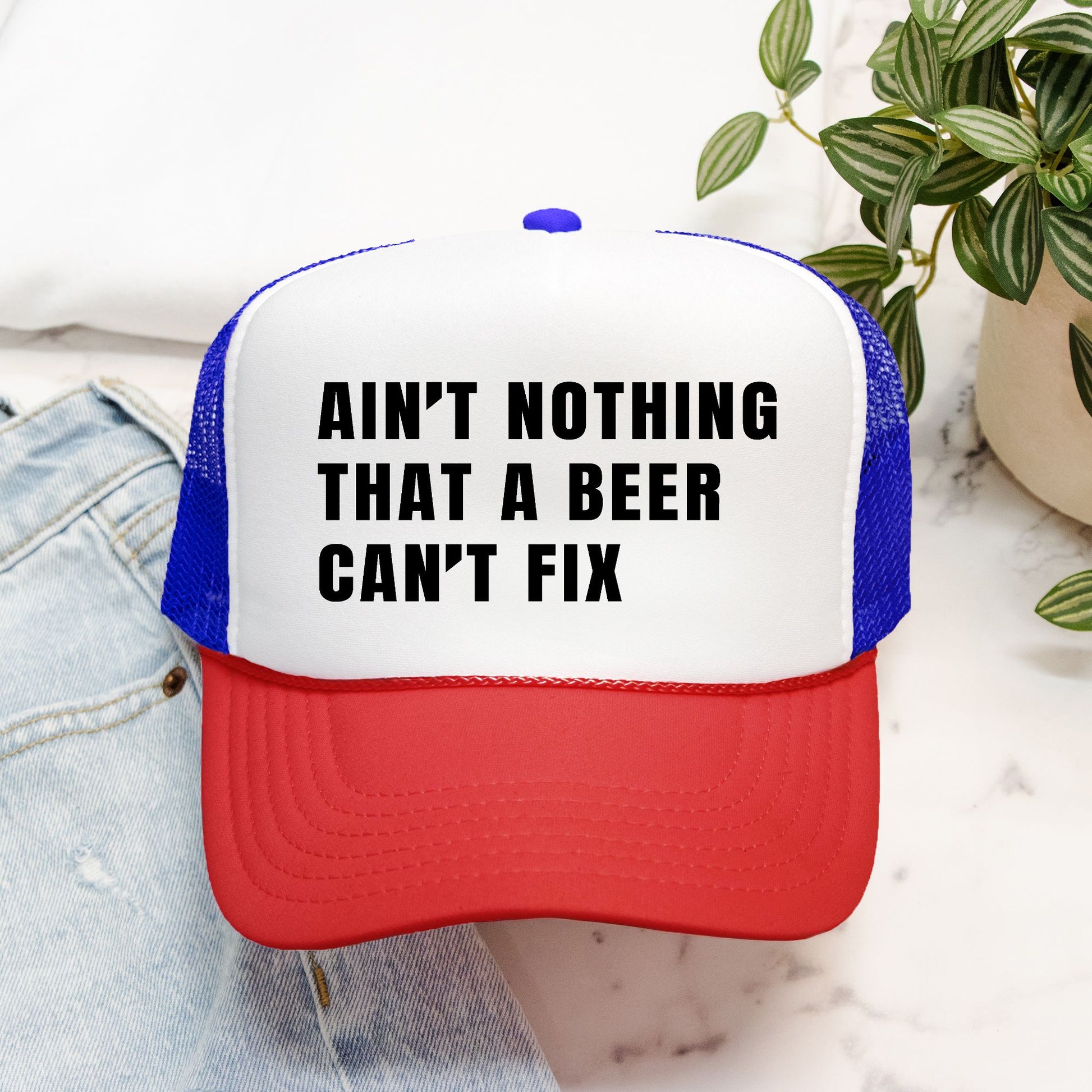 Ain’t Nothing That a Beer Can’t Fix Foam Embroidered Trucker Hat in Black Text