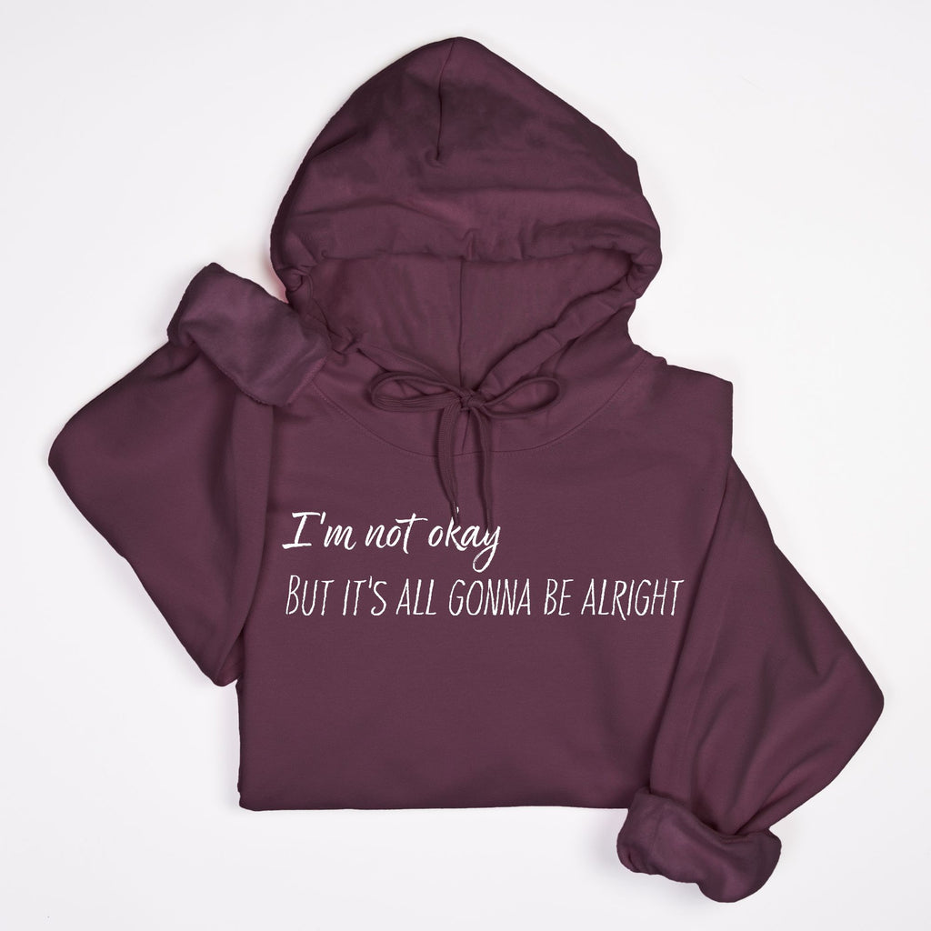 Maroon hoodie with text 'I'm not okay But it's all gonna be alright' on a white background