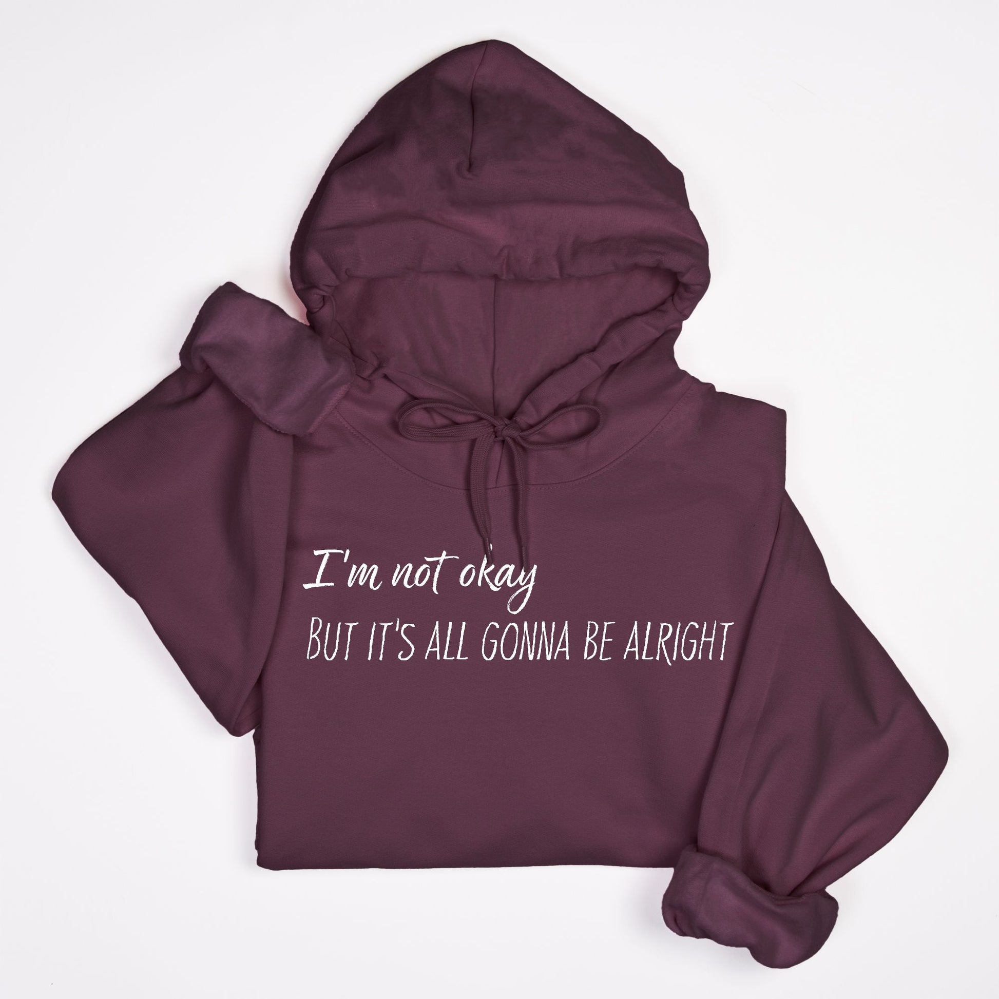 Maroon hoodie with text 'I'm not okay But it's all gonna be alright' on a white background