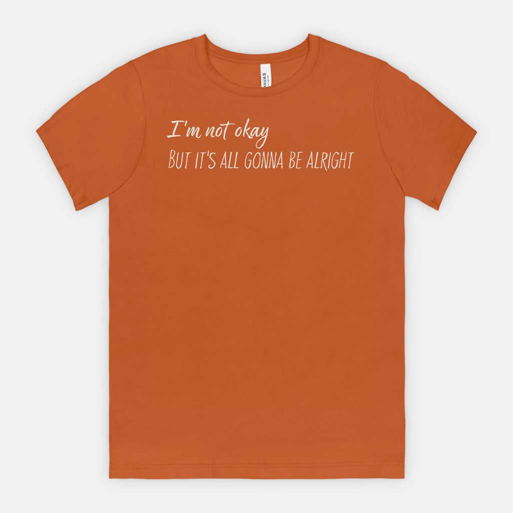 Autumn t-shirt with white text "I'm not okay but it's all gonna be alright" on a white background