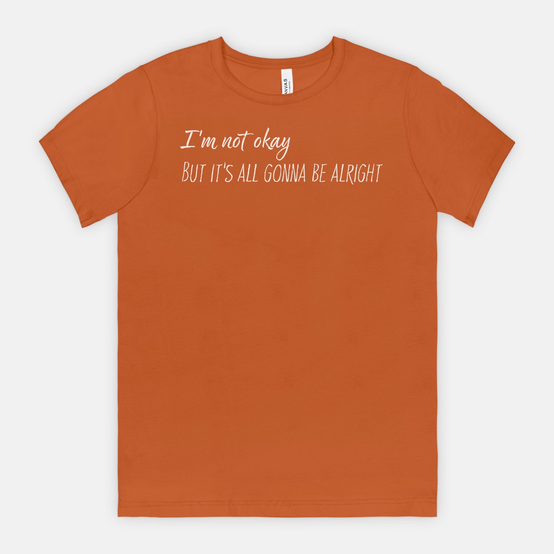 Autumn t-shirt with white text "I'm not okay but it's all gonna be alright" on a white background