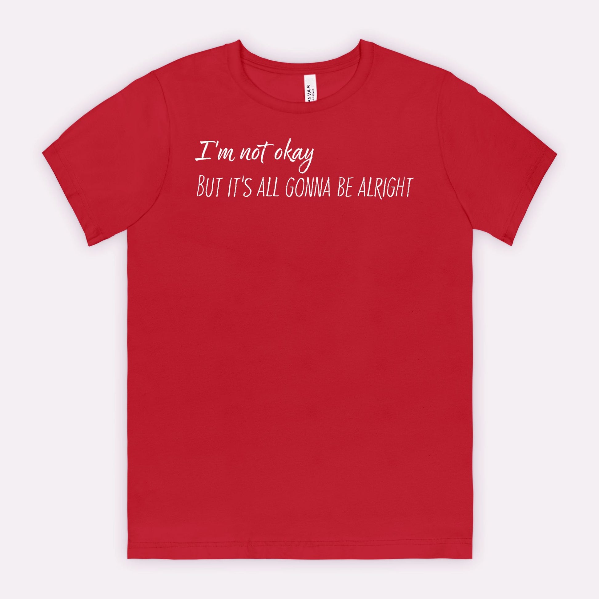 Red t-shirt with white text "I'm not okay but it's all gonna be alright"
on a white background