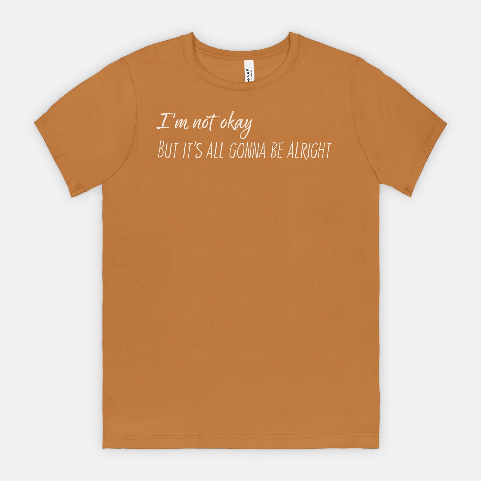Toast t-shirt with white text "I'm not okay but it's all gonna be alright" on a white background