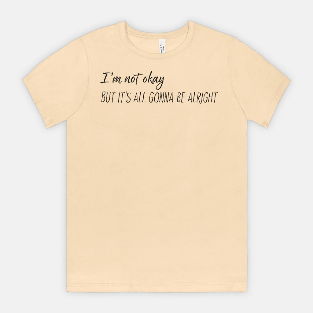 Soft Cream t-shirt with text 'I'm not okay, but it's all gonna be alright' on a white background