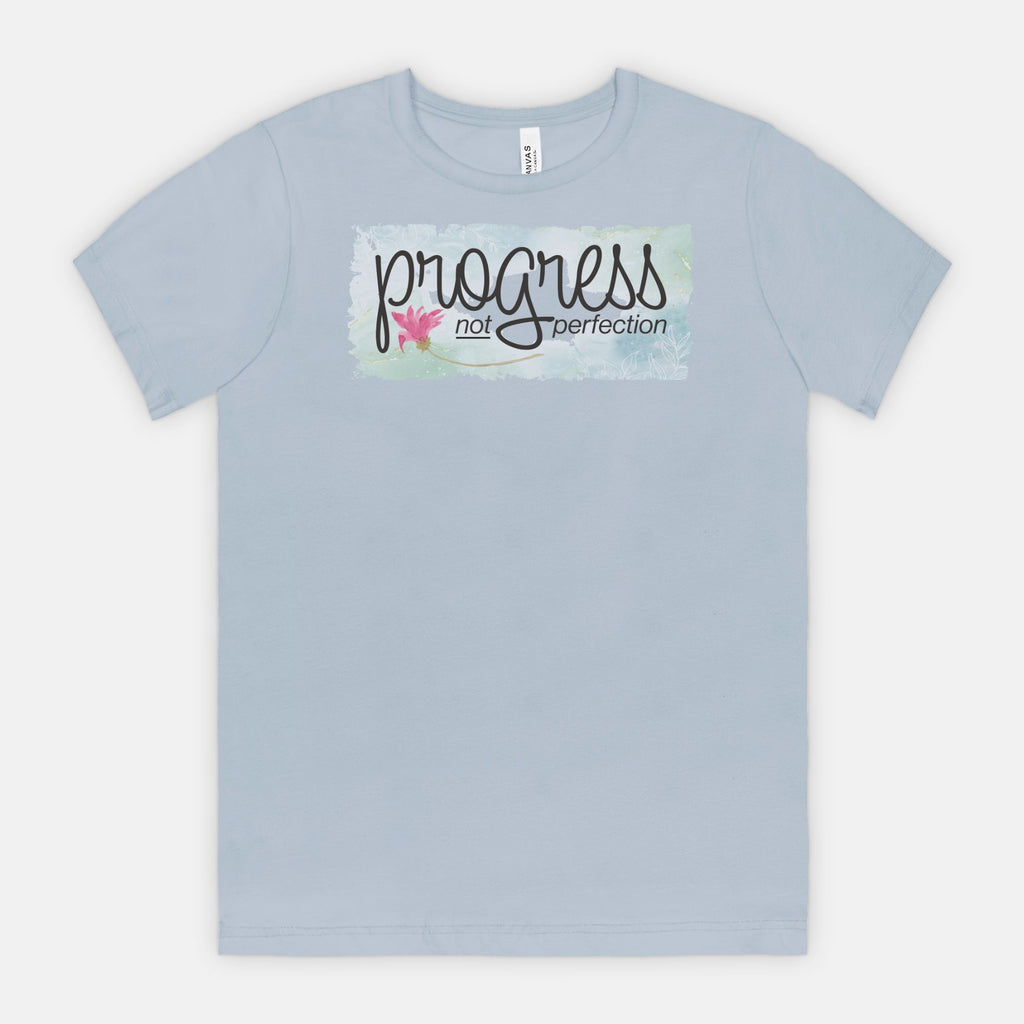 Light blue t-shirt with 'progress not perfection' text on a white background