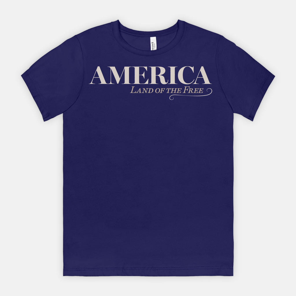 Vintage America Land of the Free patriotic typography design on Bella Canvas 3001 Team Navy T-shirt by Red Rock Chaos