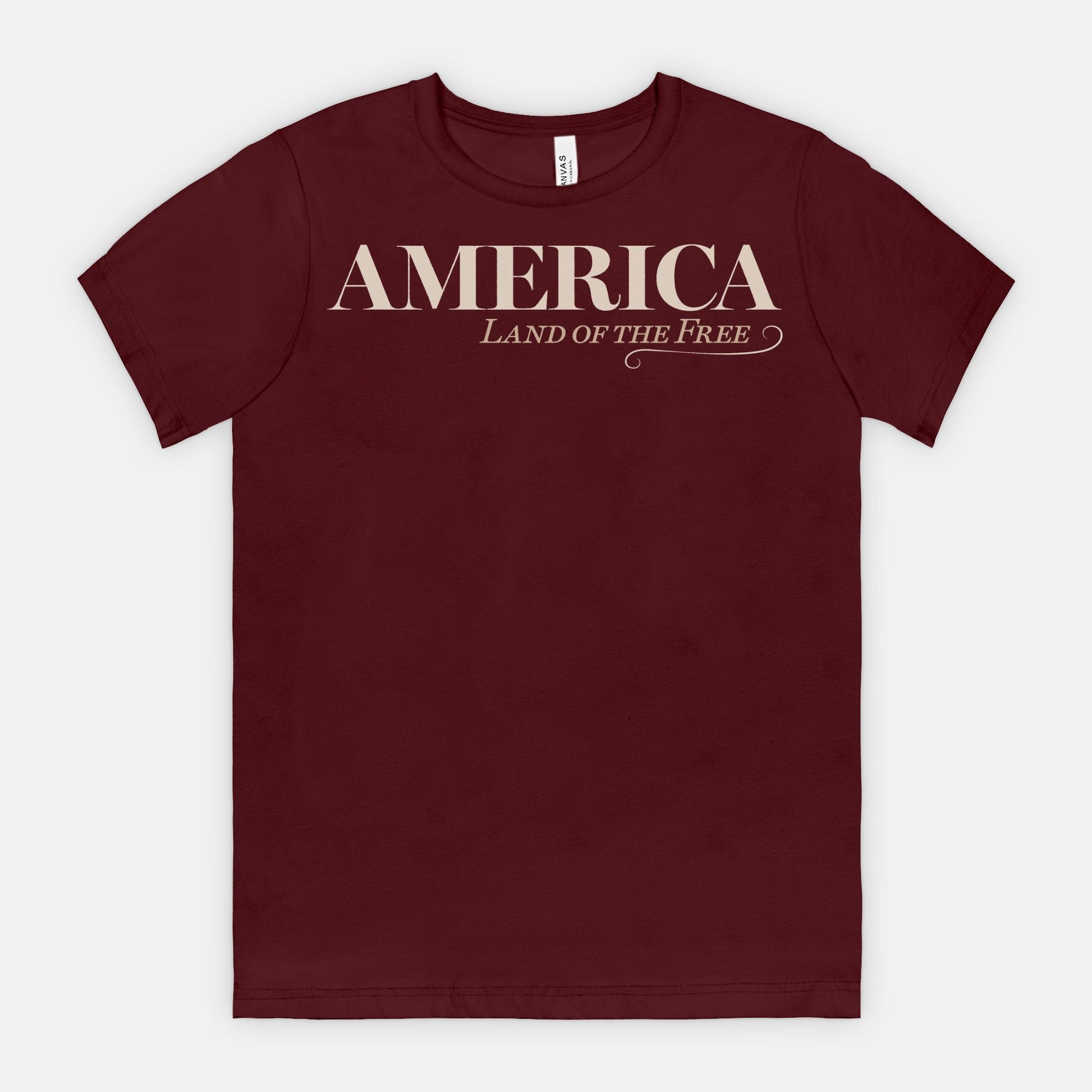 Vintage America Land of the Free patriotic typography design on Bella Canvas 3001 Maroon T-shirt by Red Rock Chaos