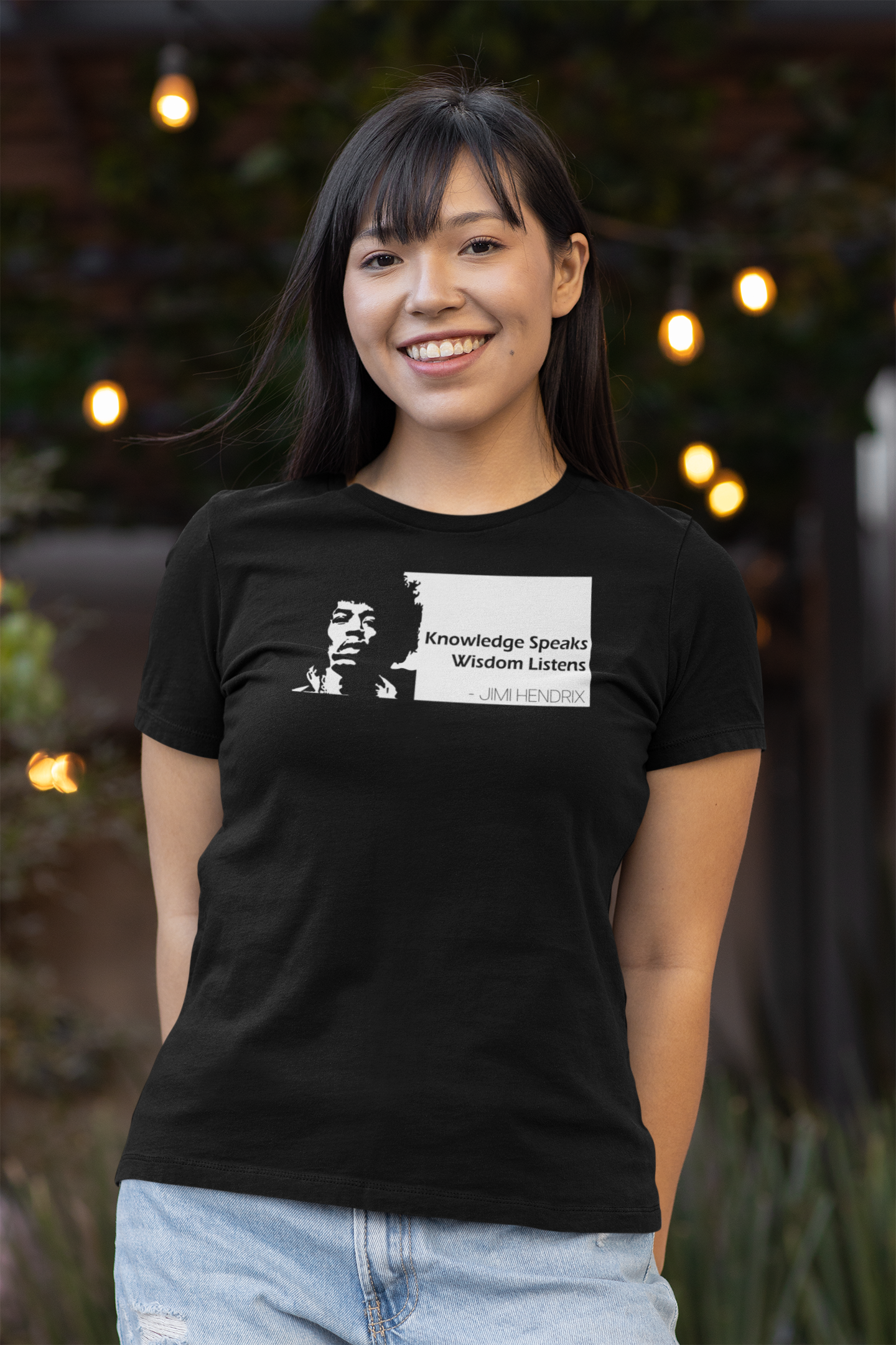 Woman wearing a black Bella Canvas 3001 T-shirt featuring Jimi Hendrix and the quote “Knowledge Speaks Wisdom Listens,” designed by Red Rock Chaos.