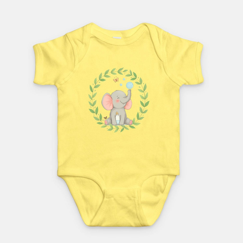 Little Chaos Crew elephant sitting with eyes closed, blowing bubbles beside a tipped bubble bottle inside green leafy wreath, minimalist baby yellow onesie design.