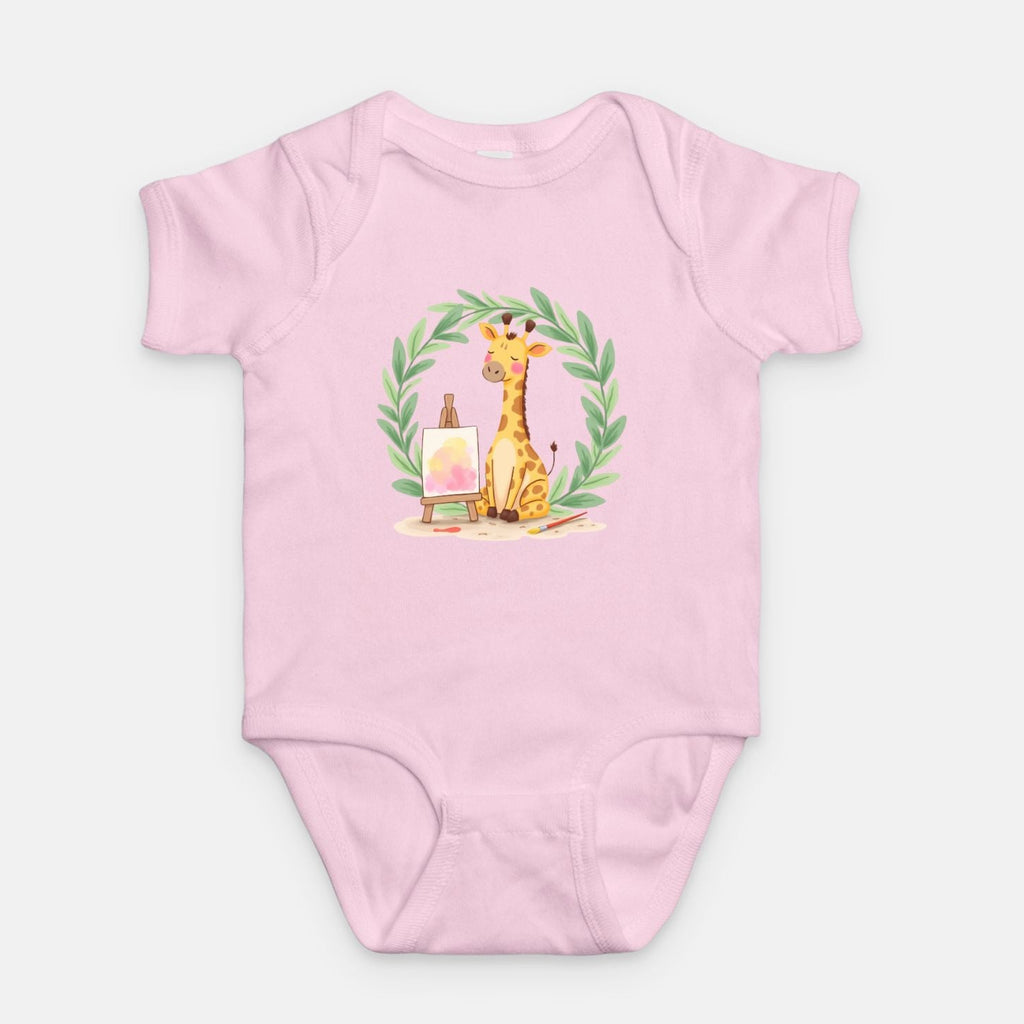 Little Chaos Crew giraffe sitting with eyes closed beside an easel and paintbrush inside green leafy wreath, minimalist baby pink onesie design.