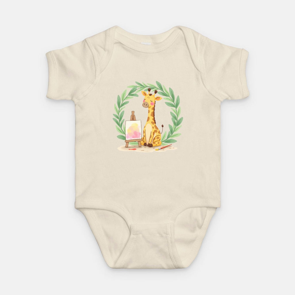 Little Chaos Crew giraffe sitting with eyes closed beside an easel and paintbrush inside green leafy wreath, minimalist baby cream onesie design.