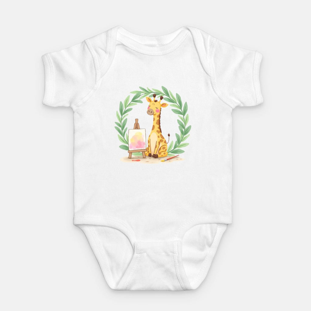 Little Chaos Crew giraffe sitting with eyes closed beside an easel and paintbrush inside green leafy wreath, minimalist baby white onesie design.