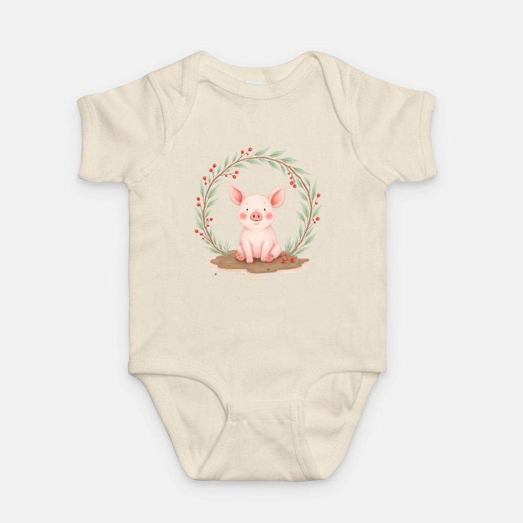 Little Chaos Crew piglet sitting in a mud puddle with eyes closed inside green leafy wreath, minimalist baby creamonesie design.
