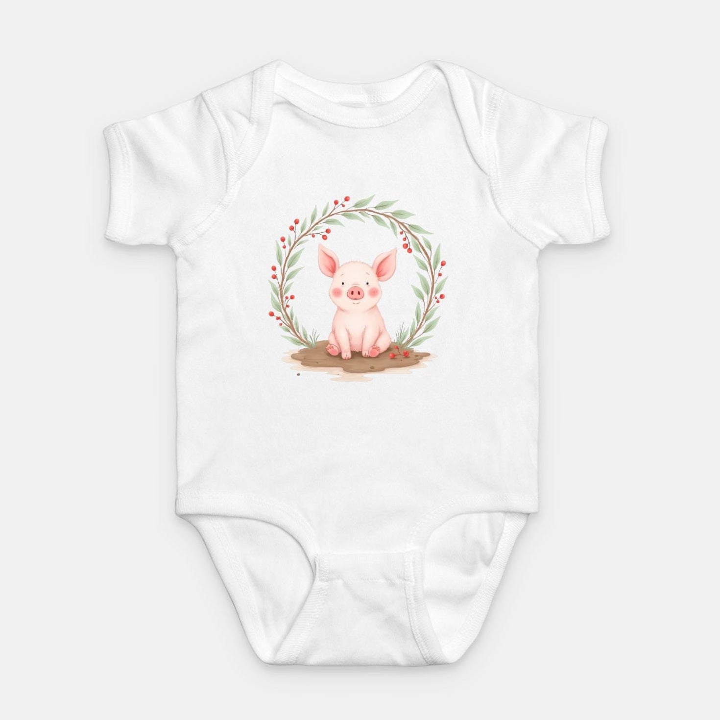 Little Chaos Crew piglet sitting in a mud puddle with eyes closed inside green leafy wreath, minimalist baby white onesie design.