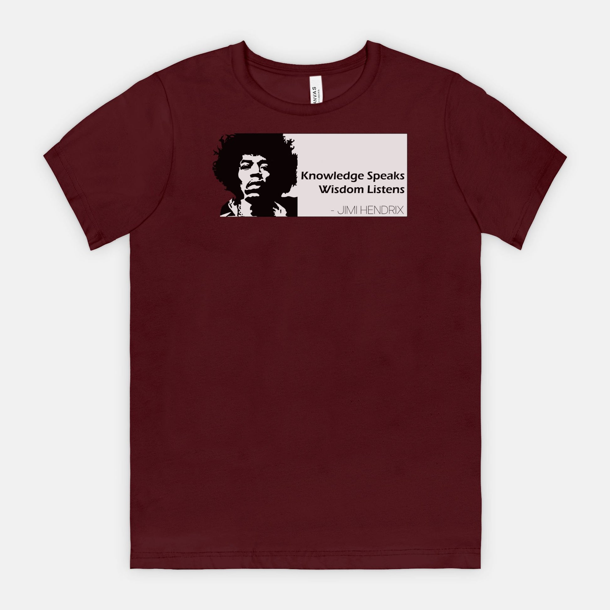 Maroon Bella Canvas 3001 T-shirt featuring a graphic of Jimi Hendrix and the white quote box that says “Knowledge Speaks Wisdom Listens,” designed by Red Rock Chaos.
