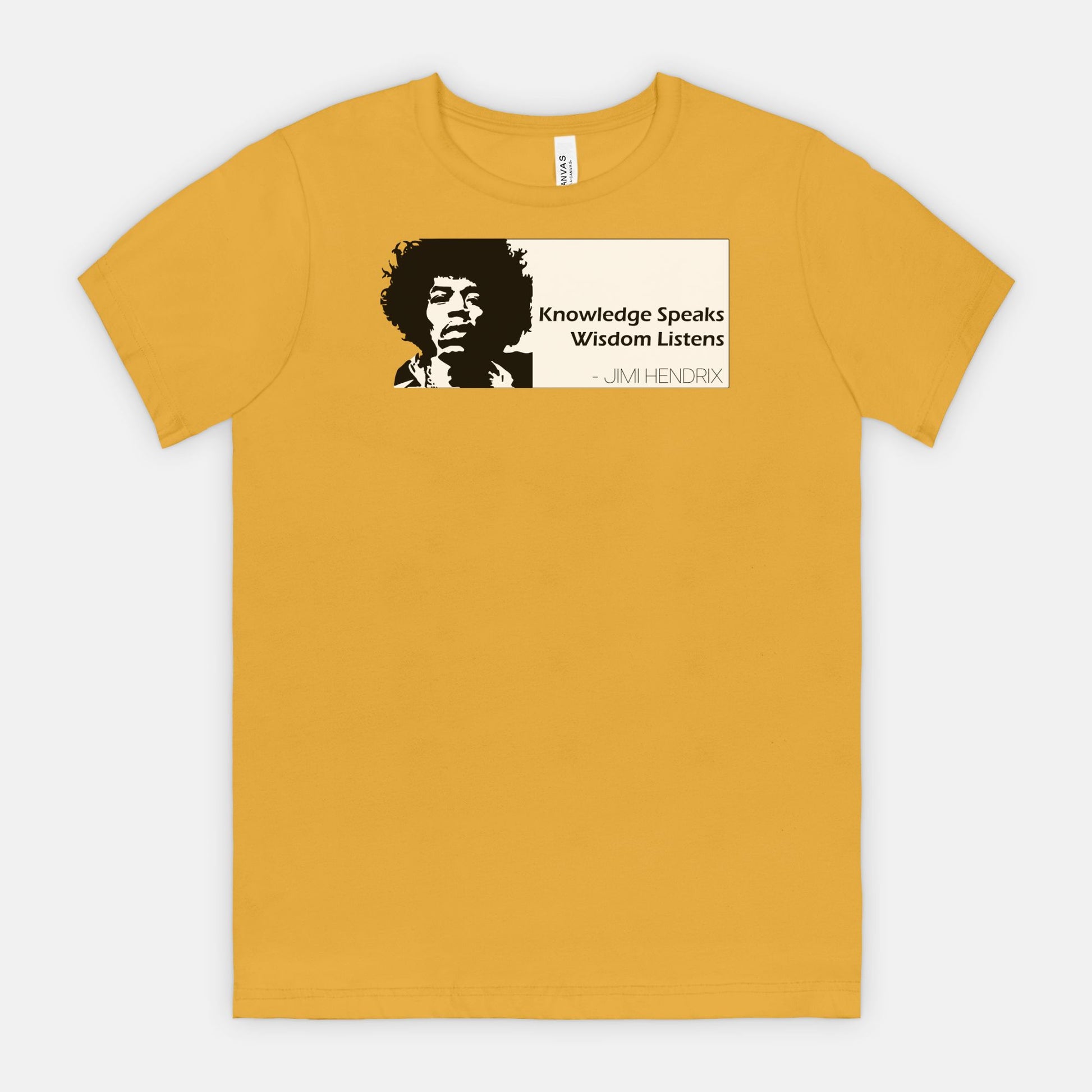 Mustard Bella Canvas 3001 T-shirt featuring a graphic of Jimi Hendrix and the white quote box that says “Knowledge Speaks Wisdom Listens,” designed by Red Rock Chaos.
